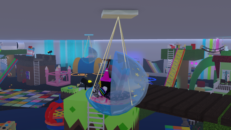 Screenshot of me sitting in some hanging seat decoration over the game Angel's Sensory Room